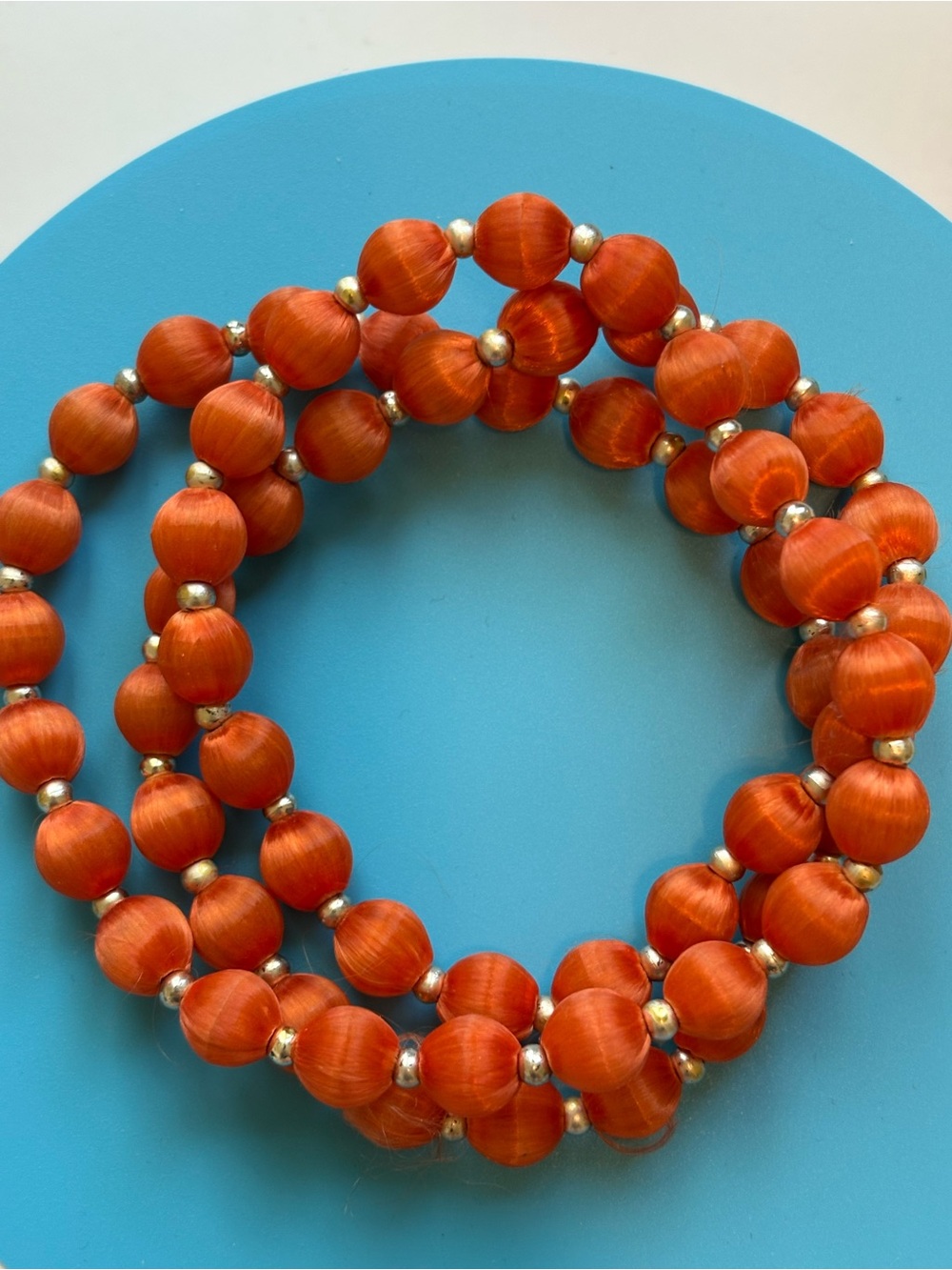 Orange Silk Thread Covered Necklace With Gold Spacer Beads